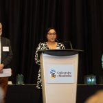 3 people presenting at the Students' Teacher Recognition Reception.