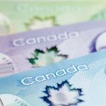 A close up of Canadian 5, 10 and 20 dollar bills.